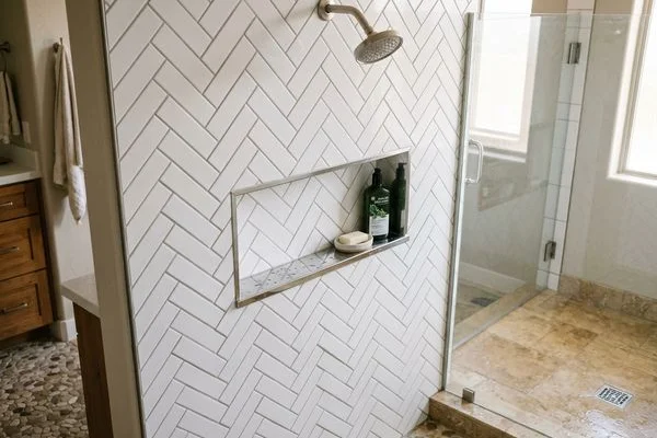 Custom tile shower with herringbone pattern